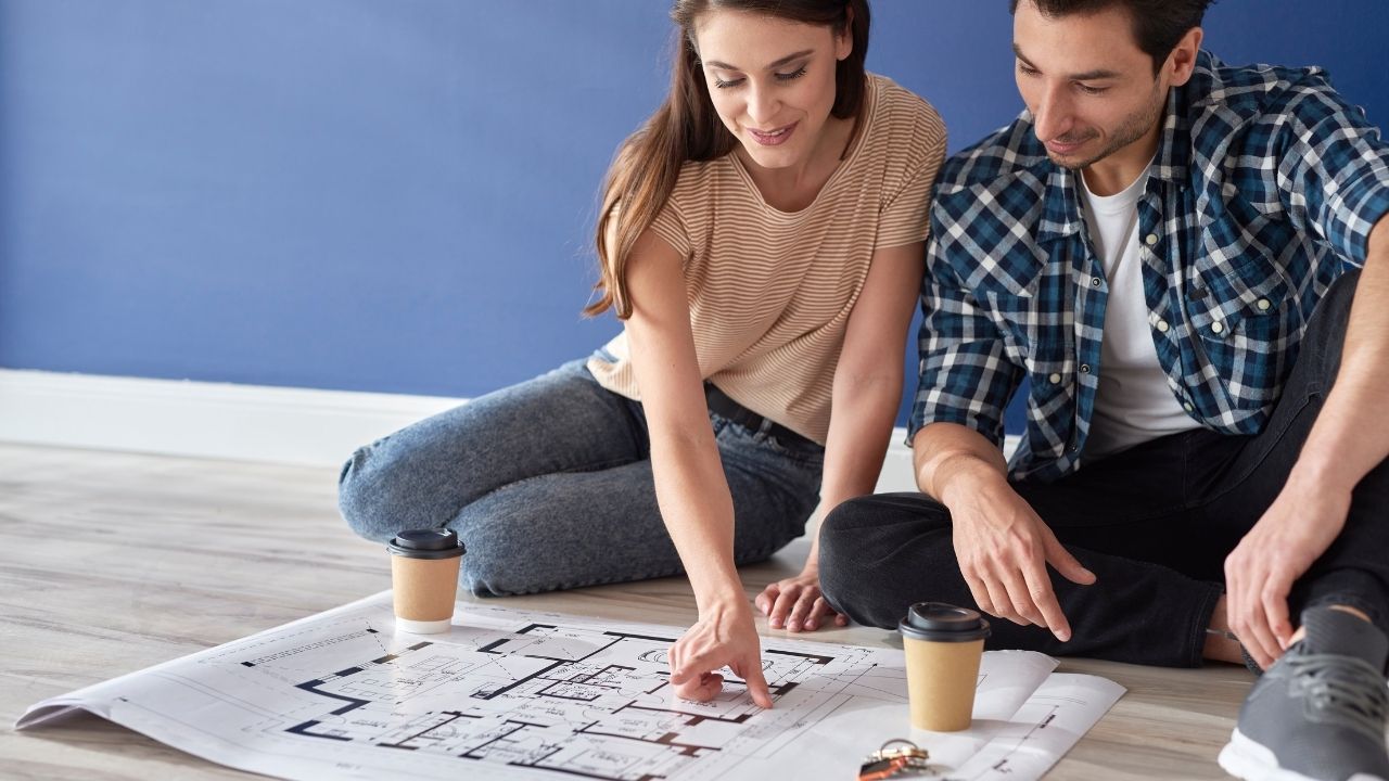 Couple Checking the Design of their Future House