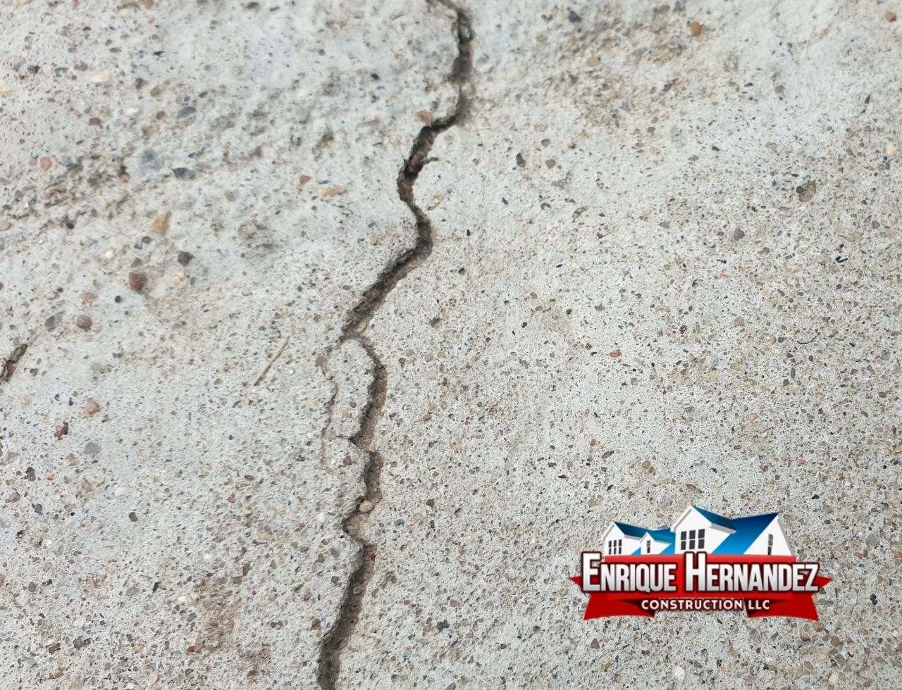 Close-up of cracks in a home’s foundation, a sign of potential foundation problems.